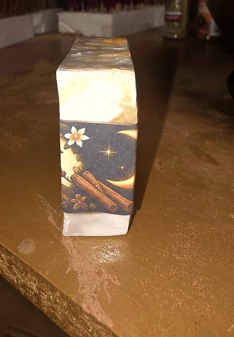 Close-up of the Prosperity soap band, with its parchment label and celestial gold artwork.