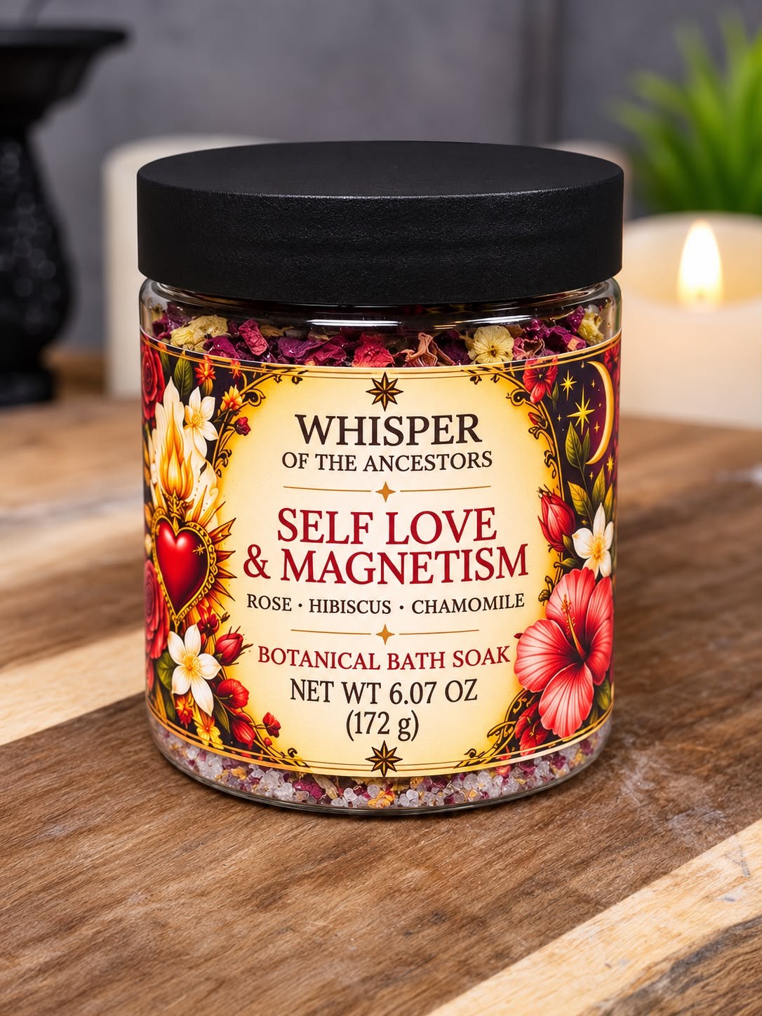 Self Love & Magnetism botanical bath soak in a clear jar with a matte black lid, layered with coarse salts, dried pink petals and chamomile flowers